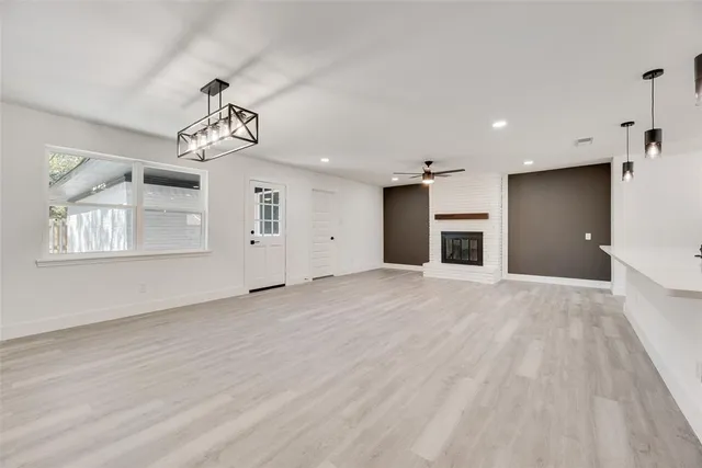 a view of a kitchen with an empty space and a window