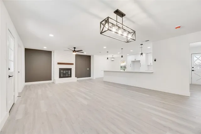a view of a kitchen with a sink and a stove