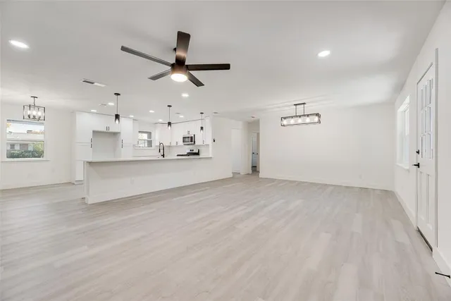 a view of a kitchen with a sink and a window