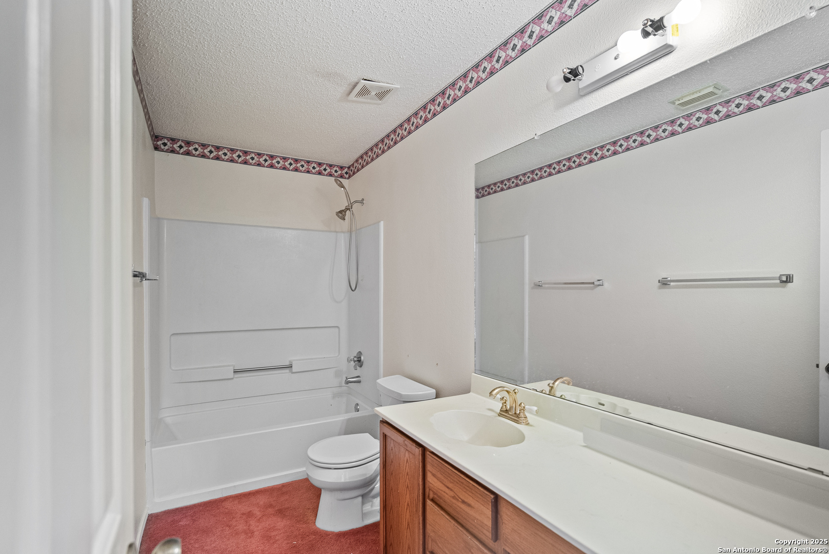 7723 Red River Bay Converse, TX 78109 - Photo 12 of 16 a bathroom with a sink a toilet and shower