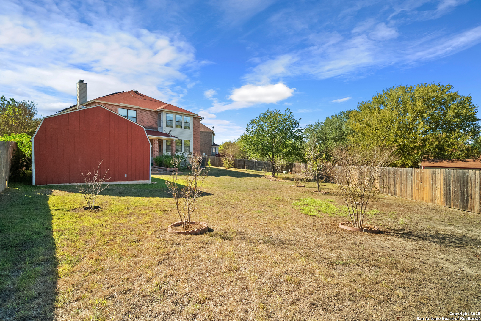 7723 Red River Bay Converse, TX 78109 - Photo 13 of 16 a backyard of a house with table and chairs