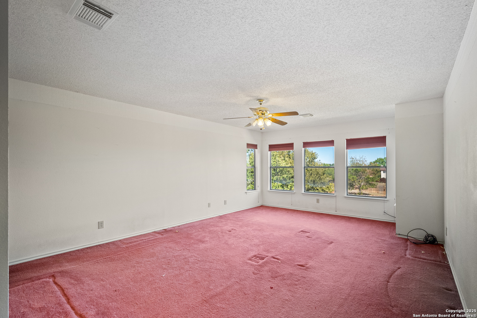 7723 Red River Bay Converse, TX 78109 - Photo 10 of 16 an empty room with windows