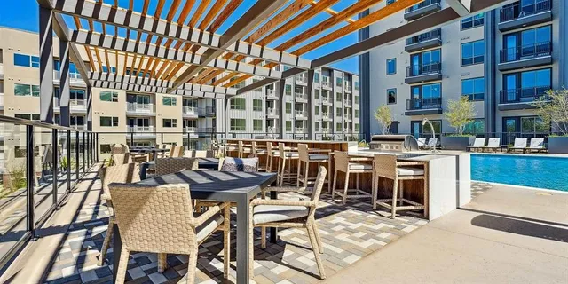 a view of a chairs and table in the patio
