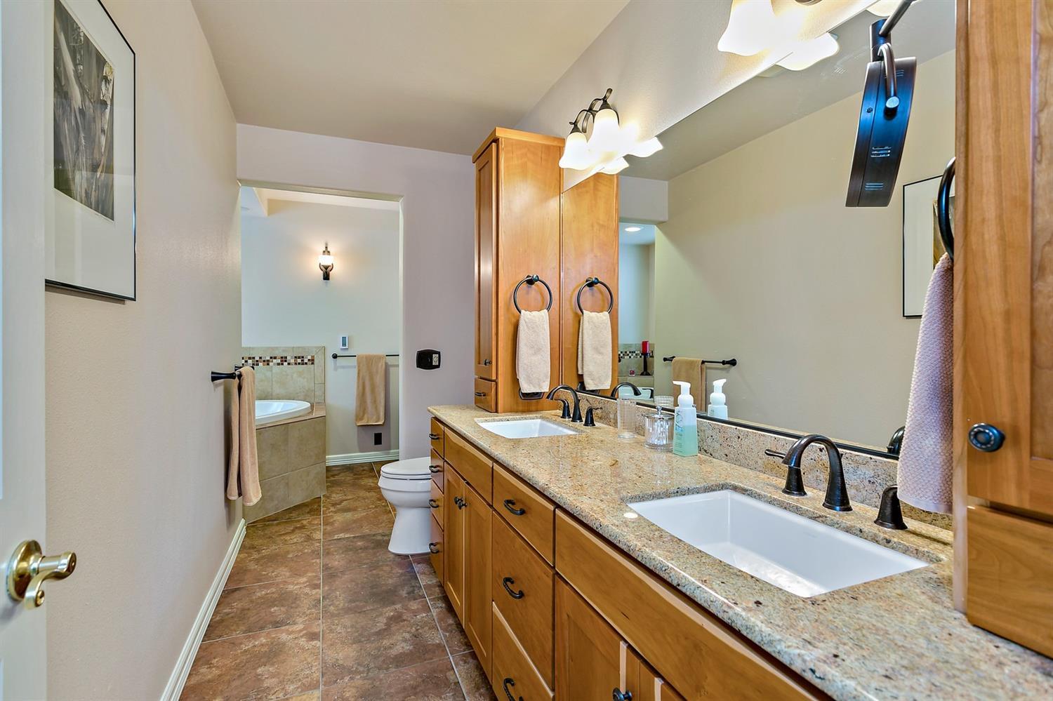 1000 Crow Road Merlin, OR 97532 - Photo 18 of 31 a bathroom with a granite countertop double vanity sink and mirror