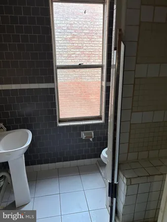 a view of a livingroom with furniture and a fireplace