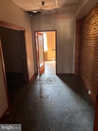 a view of an empty room with a fireplace