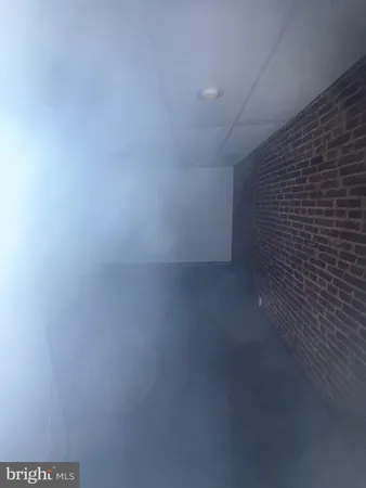 a bathroom with a sink a toilet a window and vanity