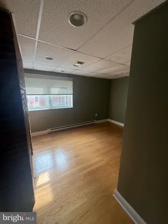 a view of empty room with a fireplace