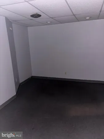 a view of an empty room with a fireplace