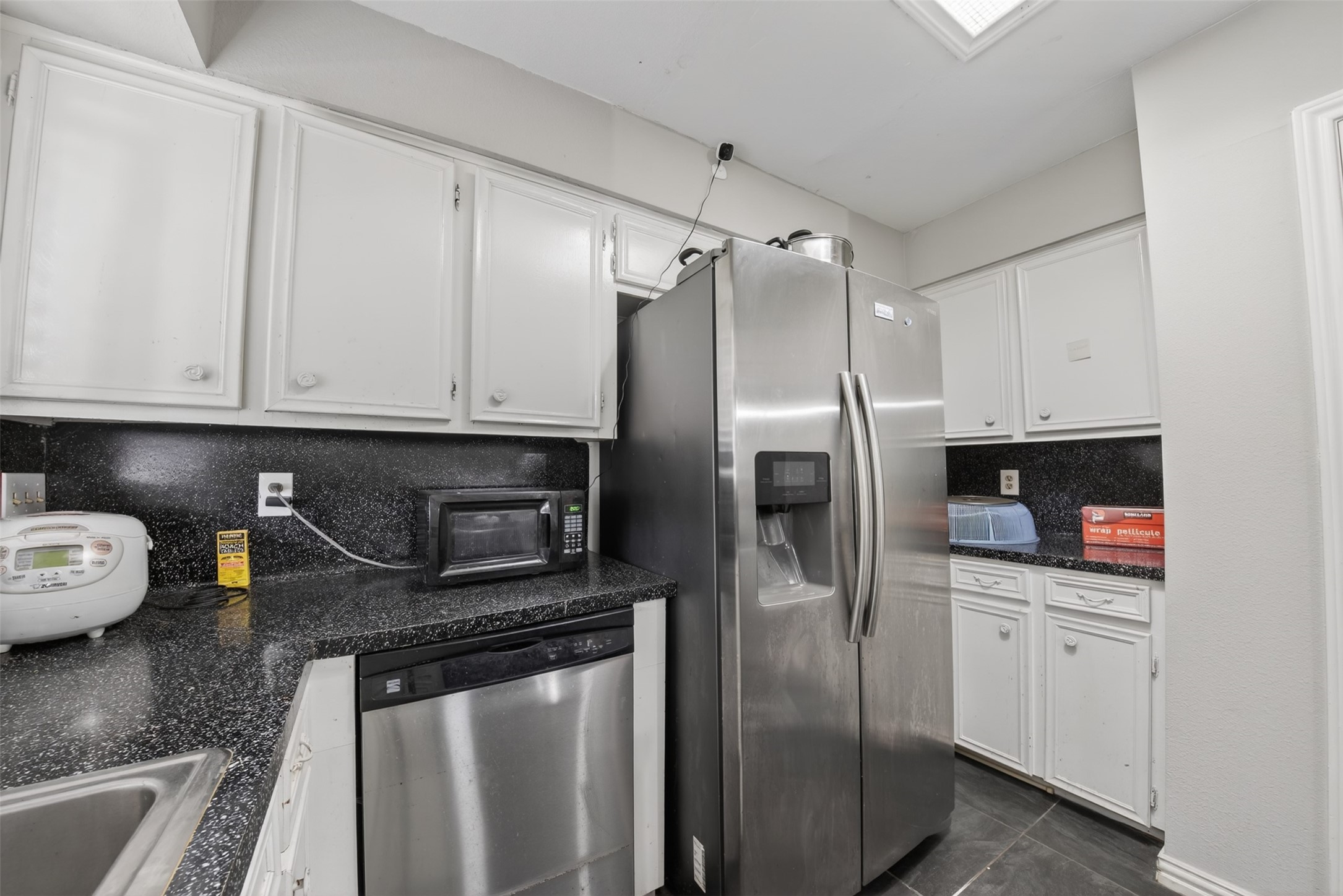 8029 Tareyton Lane Houston, TX 77075 - Photo 8 of 20 a kitchen with stainless steel appliances granite countertop a refrigerator a stove and a sink