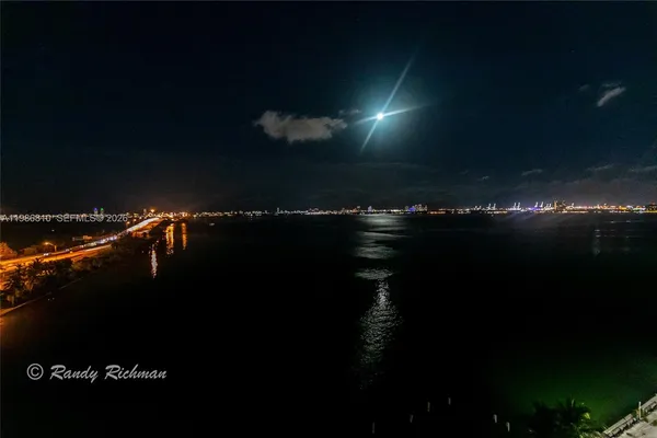a sunset view with a lake