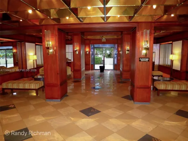 a view of a lobby with a table and chair