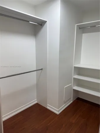 a view of an empty walk in closet