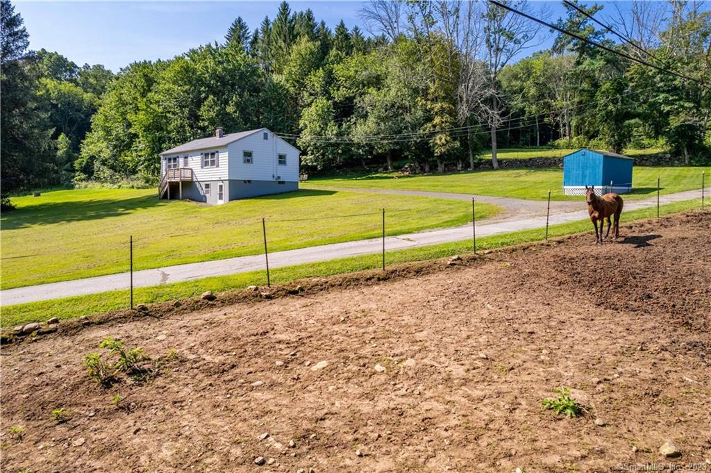 225 South Windham Road Windham, CT 06226 - Photo 1 of 1 a view of a yard with wooden fence