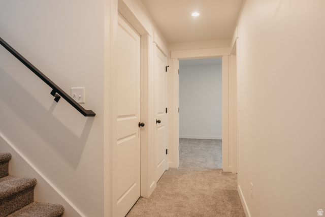 4595 North Fallow Way, Unit 511 Eagle Mountain, UT 84005 - Photo 29 of 32 Hall with stairs and light carpet