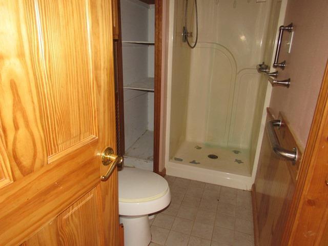 422 Evans Hollow Road Murphy, NC 28906 - Photo 16 of 34 a bathroom with a shower and a toilet