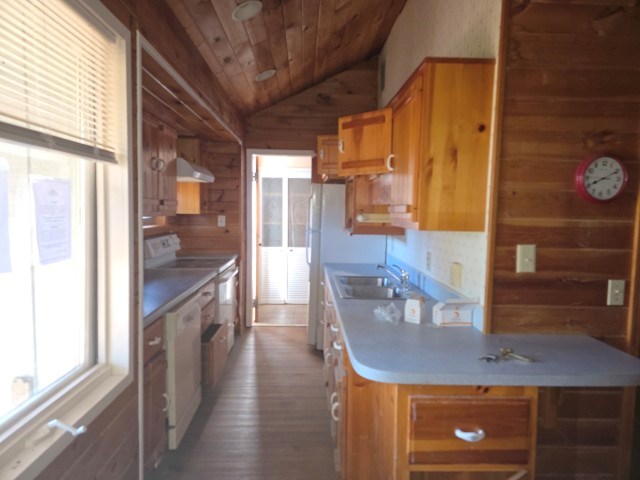 422 Evans Hollow Road Murphy, NC 28906 - Photo 6 of 34 a kitchen with a wooden floor and a view of living room
