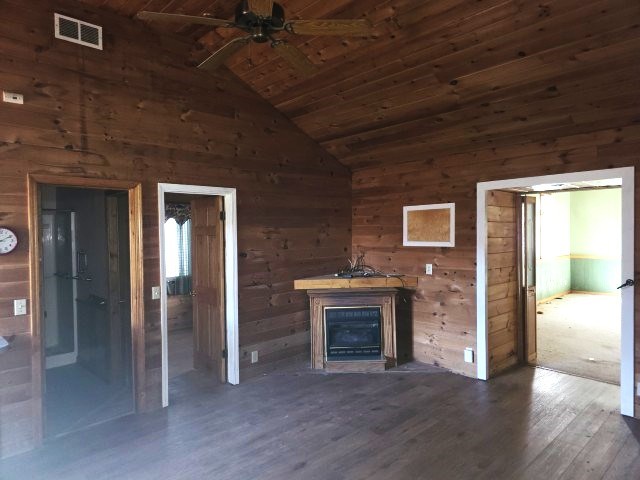 422 Evans Hollow Road Murphy, NC 28906 - Photo 8 of 34 a view of an empty room with a fireplace