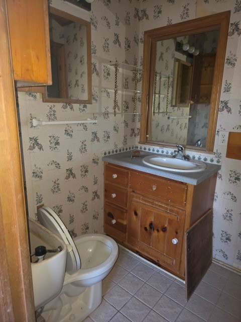 422 Evans Hollow Road Murphy, NC 28906 - Photo 9 of 34 a bathroom with a granite countertop toilet sink and mirror