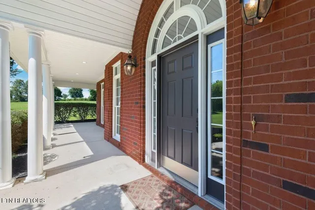an aerial view of a house with a swimming pool
