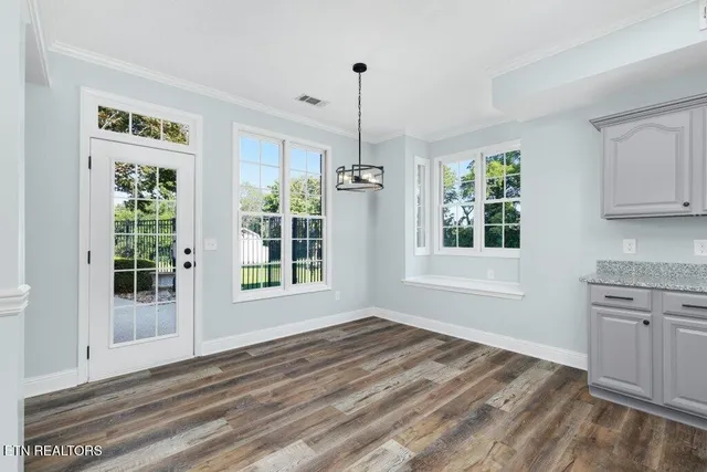 a spacious bathroom with a tub sink and mirror
