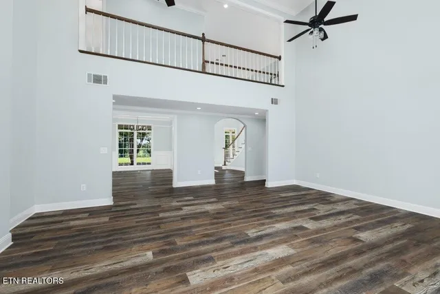 a view of an entryway with wooden floor