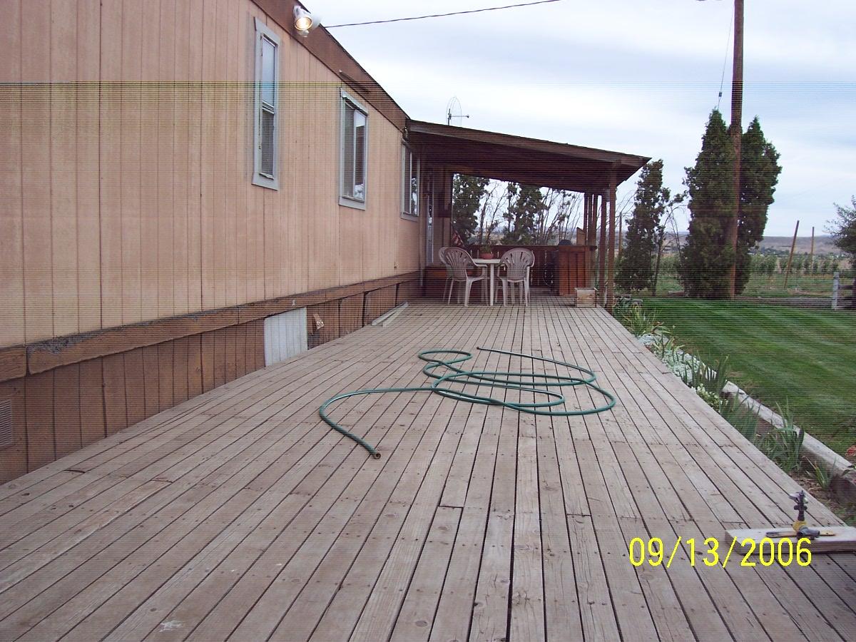 1702 Moore Road Yakima, WA 98908 - Photo 4 of 10 a view of a roof deck with table and chairs with wooden floor