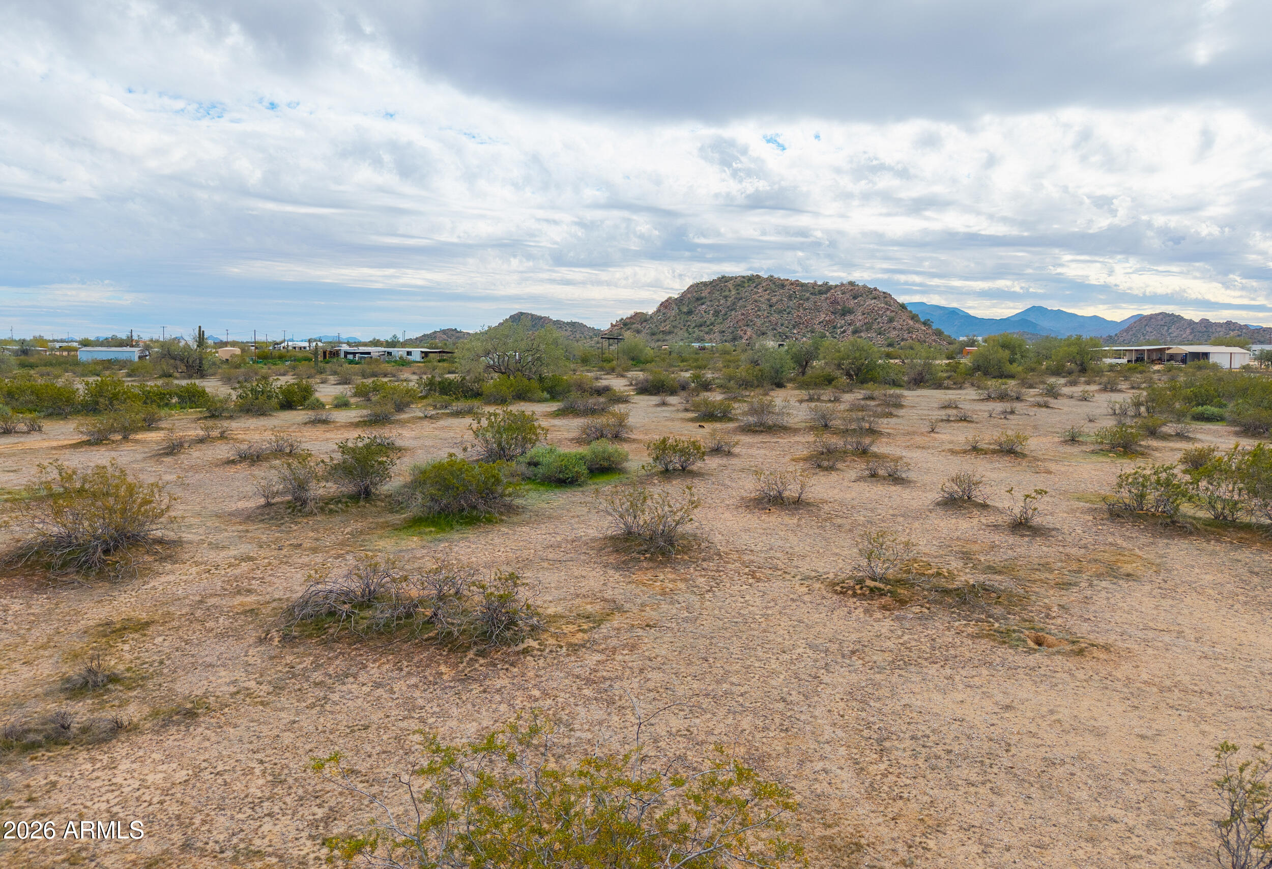 0 West Dune Shadow Road, Unit 42 Maricopa, AZ 85139 - Photo 9 of 25 a view of a lake with mountains in the background