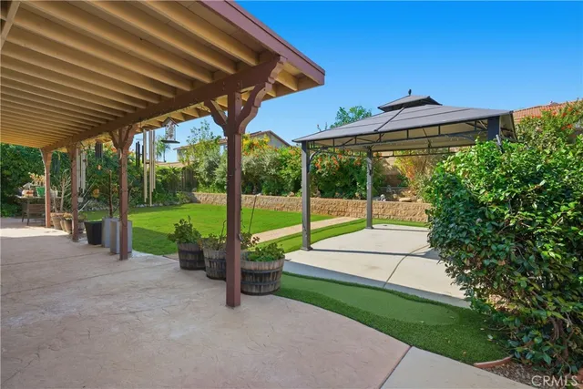 a view of a house with porch and a garden