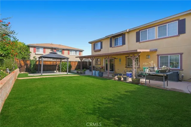 a view of a house with a yard porch and sitting area
