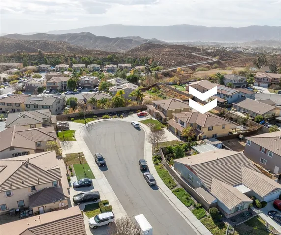 an aerial view of residential houses with outdoor space