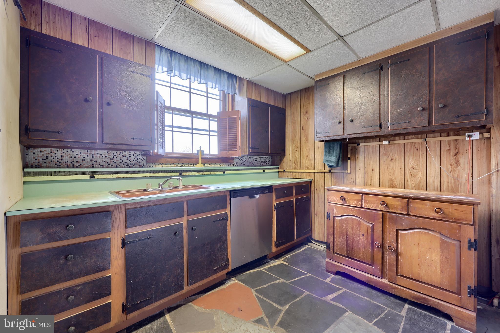 488 Fell Road Rising Sun, MD 21911 - Photo 54 of 90 a kitchen with stainless steel appliances granite countertop a stove a sink and a microwave