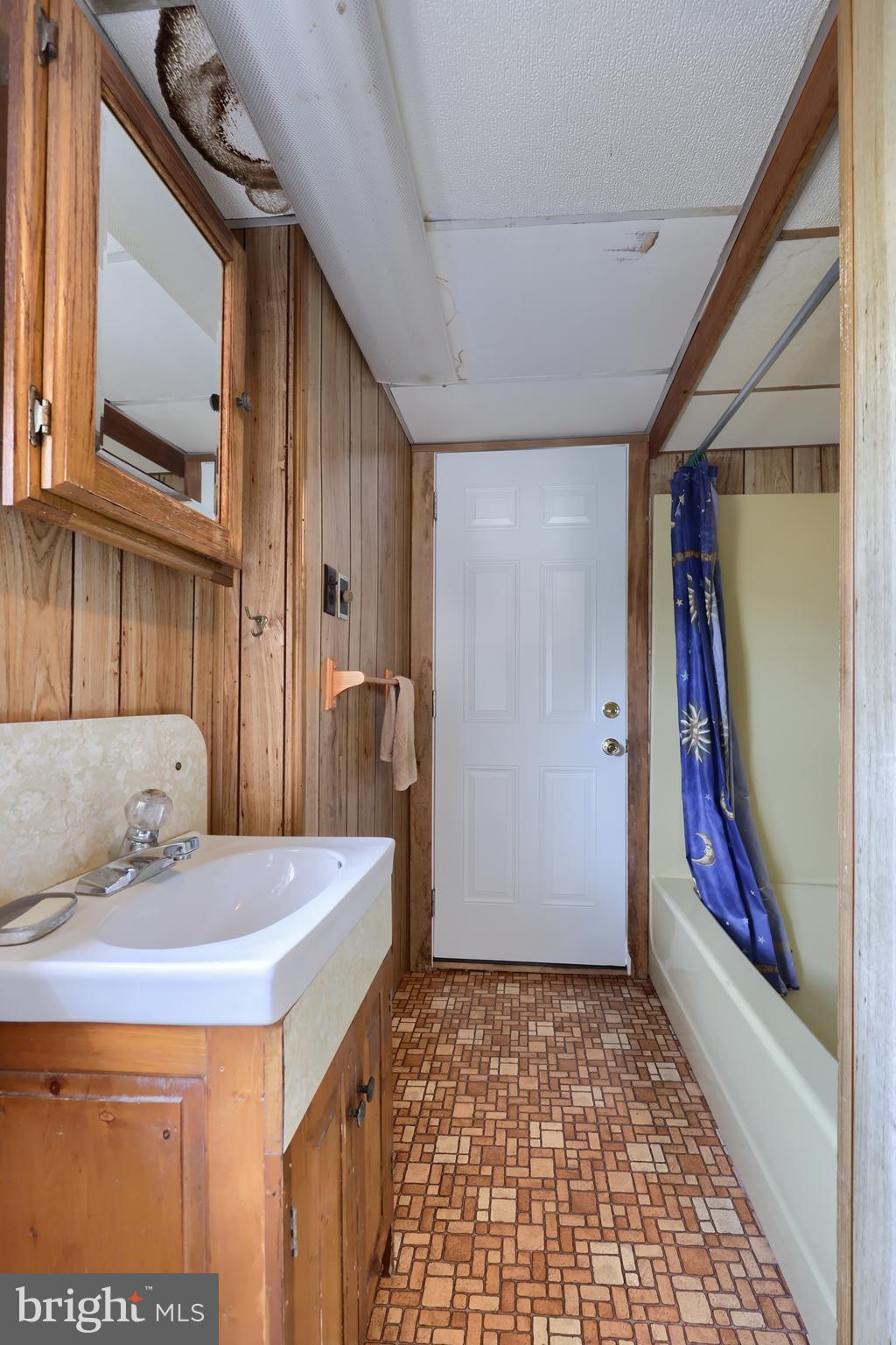 488 Fell Road Rising Sun, MD 21911 - Photo 59 of 90 a bathroom with a sink and a mirror