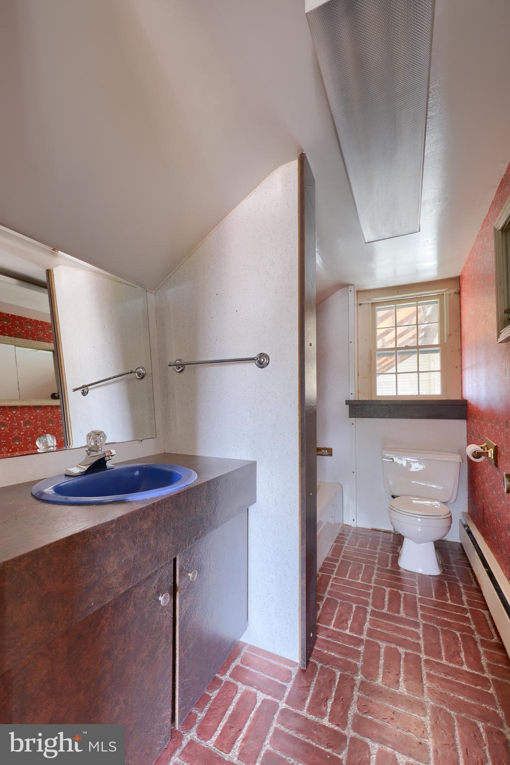 488 Fell Road Rising Sun, MD 21911 - Photo 77 of 90 a spacious bathroom with a sink and a mirror