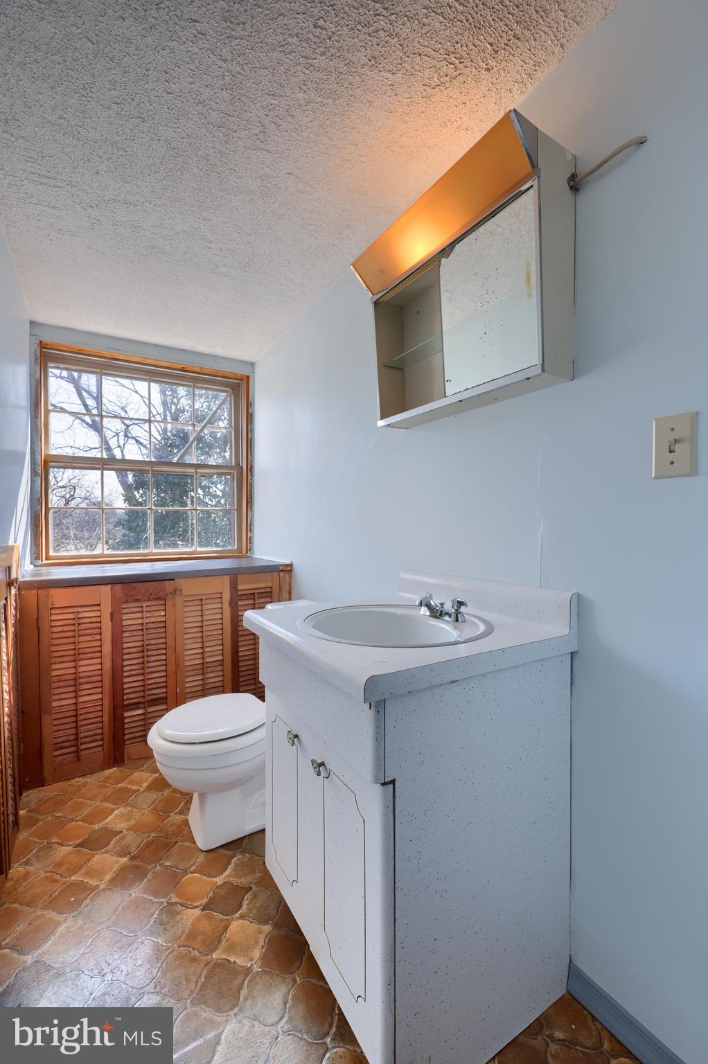 488 Fell Road Rising Sun, MD 21911 - Photo 84 of 90 a bathroom with a sink a toilet and a window