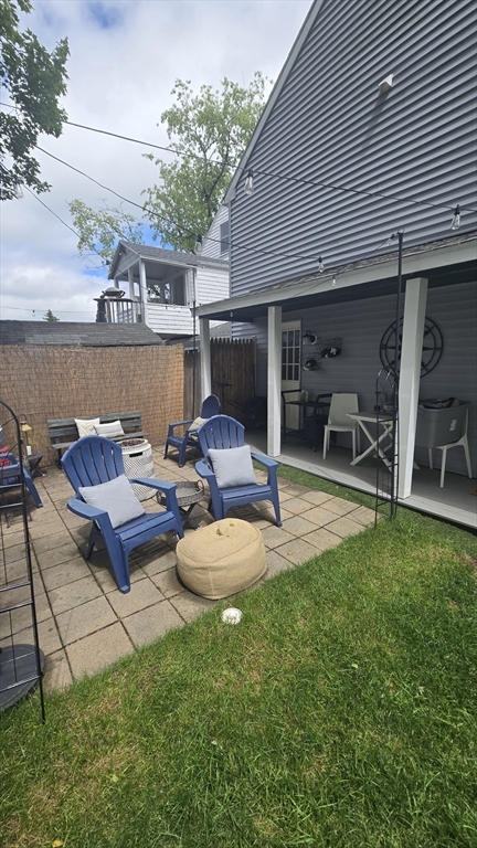 15 Central Street, Unit 4 Georgetown, MA 01833 - Photo 23 of 24 a view of a backyard with a patio and outdoor seating