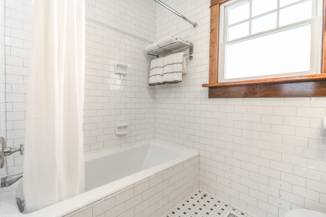 2140 Cedar Road Homewood, IL 60430 - Photo 17 of 25 a bathroom with a bathtub and next to a window