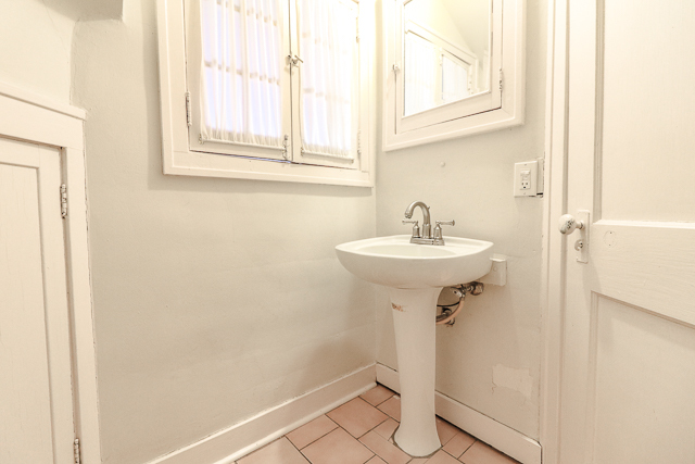 2140 Cedar Road Homewood, IL 60430 - Photo 21 of 25 a bathroom with a sink and a mirror