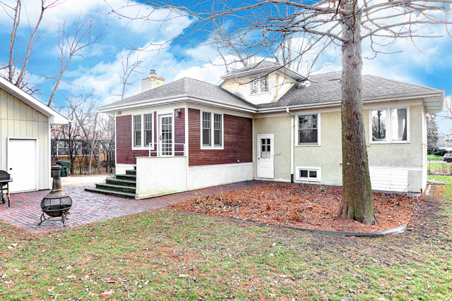 2140 Cedar Road Homewood, IL 60430 - Photo 24 of 25 a front view of a house with a yard and garage