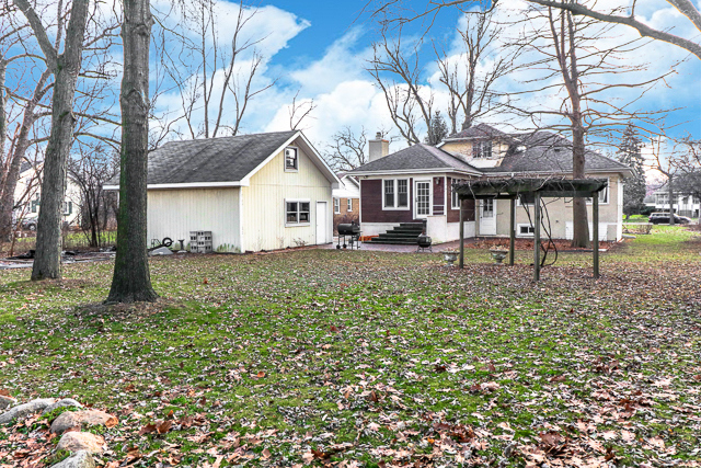 2140 Cedar Road Homewood, IL 60430 - Photo 25 of 25 a front view of a house with a garden
