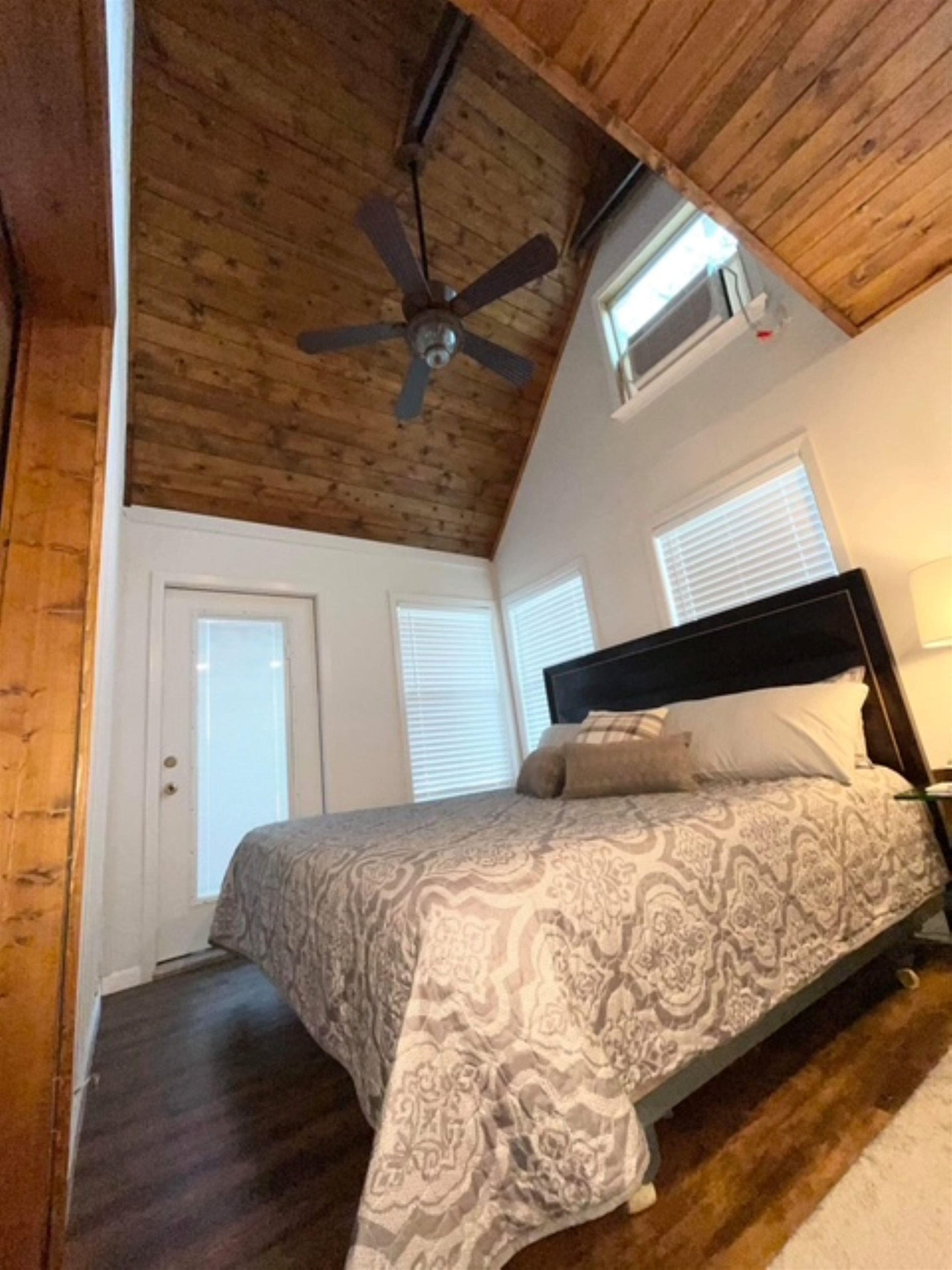 602 Sycamore Road Burnet, TX 78611 - Photo 15 of 26 a bedroom with a bed and a mirror