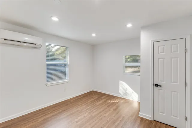 a bathroom with a shower and a sink