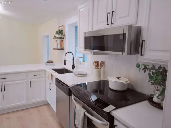 a kitchen with a sink and cabinets