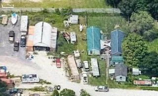 an aerial view of residential houses with outdoor space