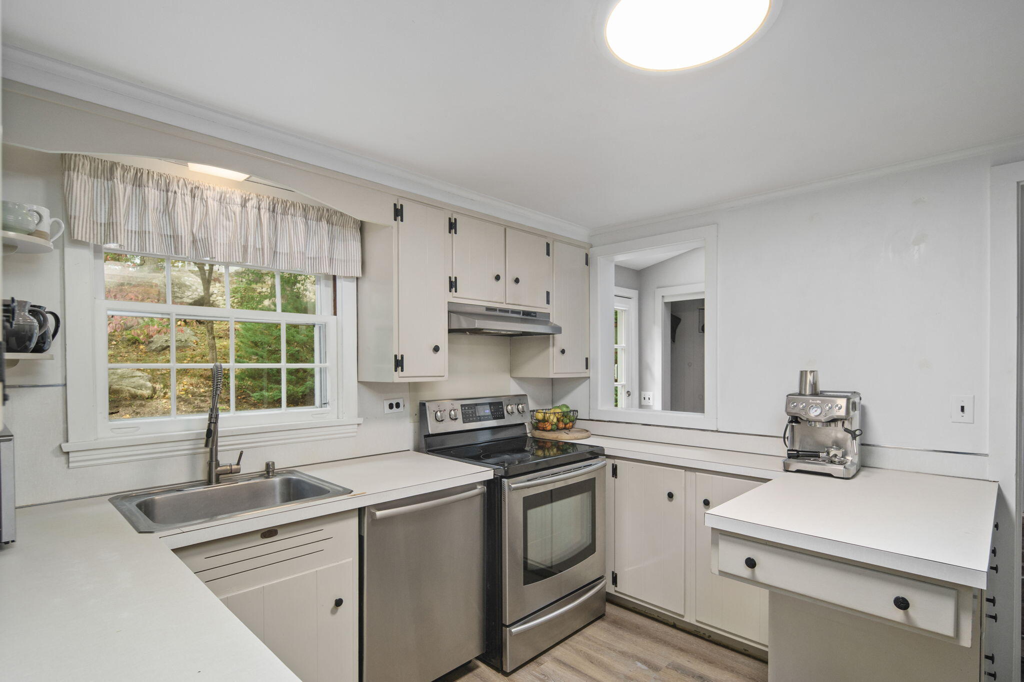 7 Little Brook Road Rowayton, CT 06853 - Photo 11 of 36 a kitchen with a sink stove and cabinets