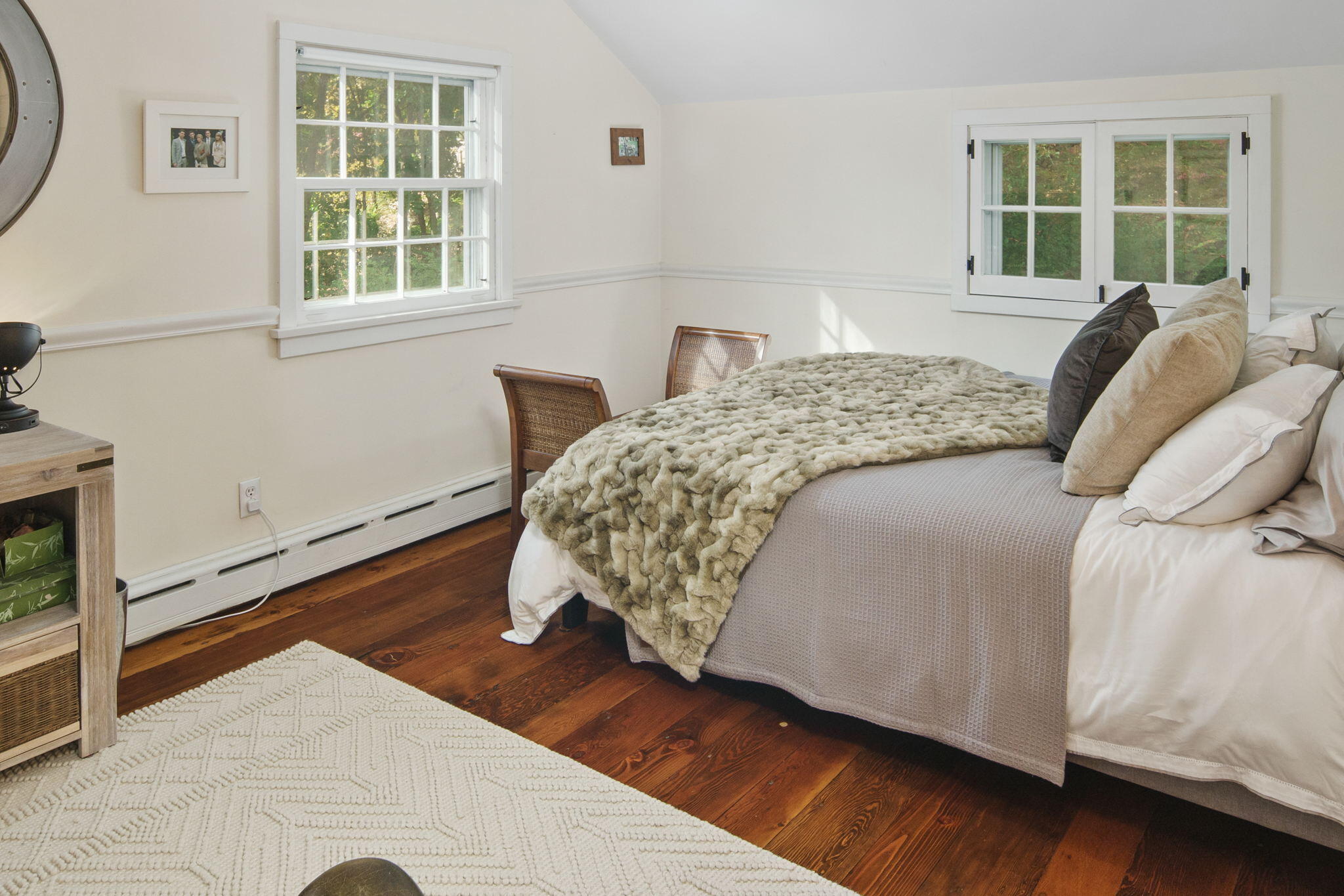 7 Little Brook Road Rowayton, CT 06853 - Photo 23 of 36 a bed sitting in a bedroom next to a window