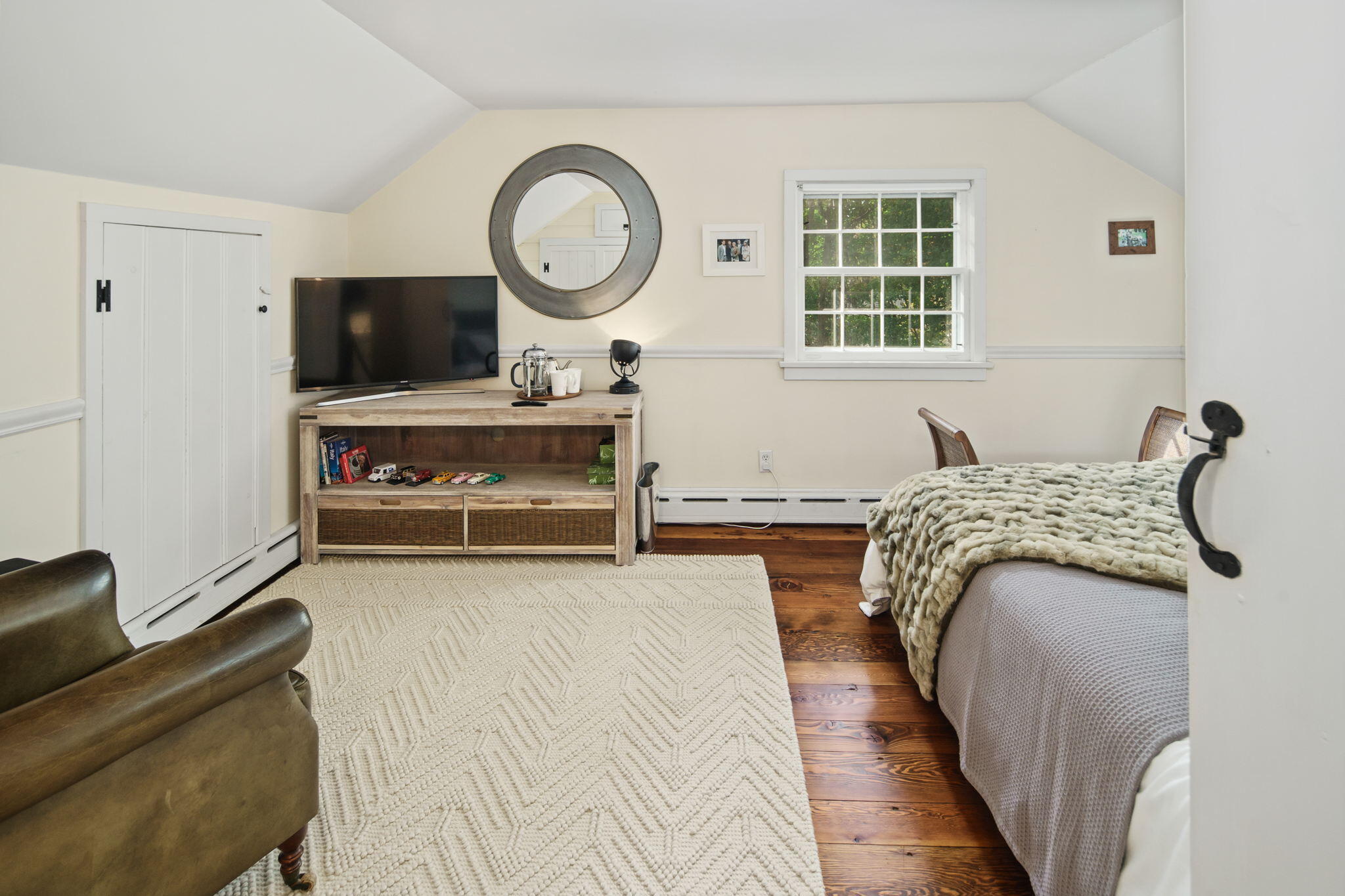 7 Little Brook Road Rowayton, CT 06853 - Photo 24 of 36 a living room with furniture and a flat screen tv