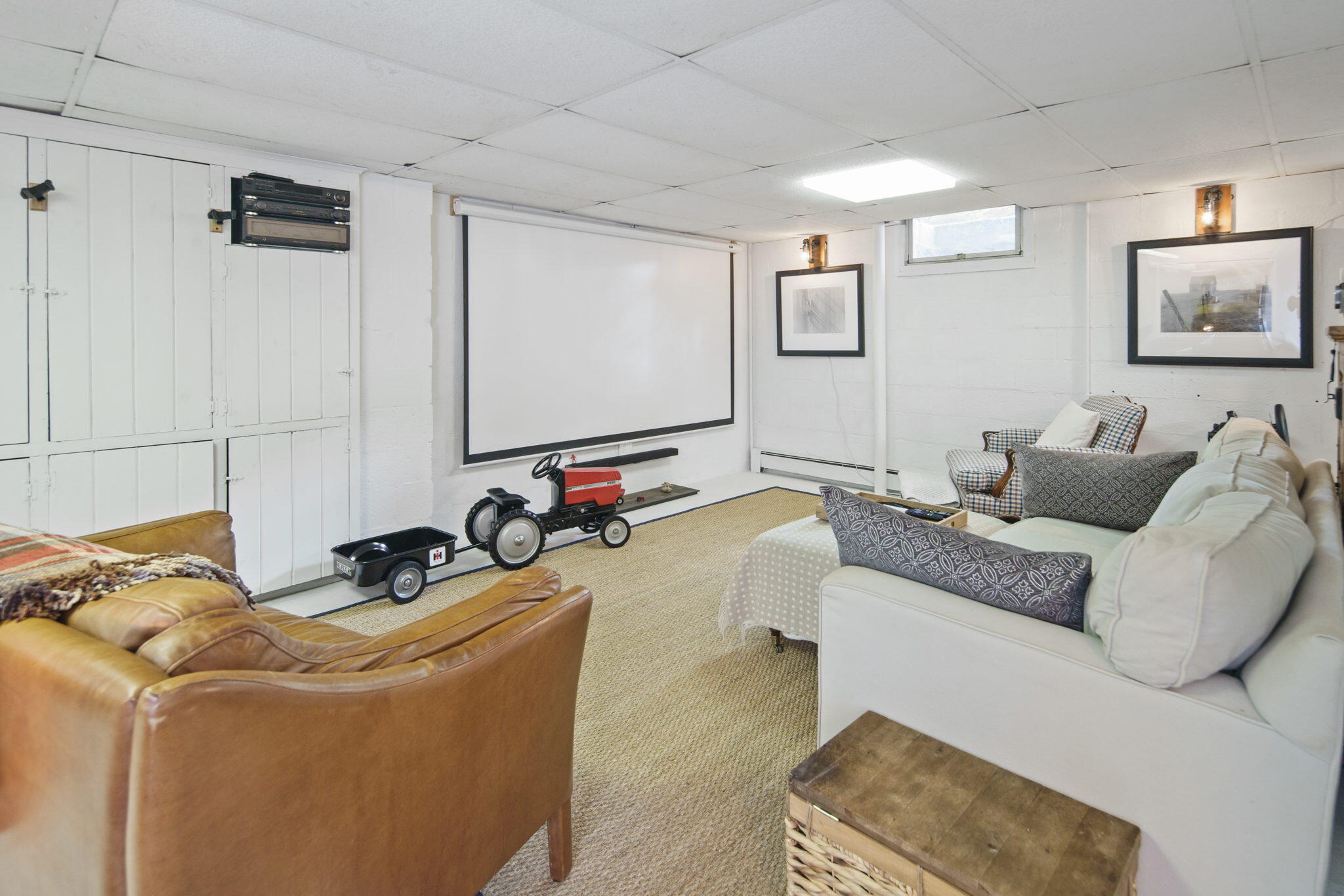 7 Little Brook Road Rowayton, CT 06853 - Photo 27 of 36 a living room with furniture and a flat screen tv