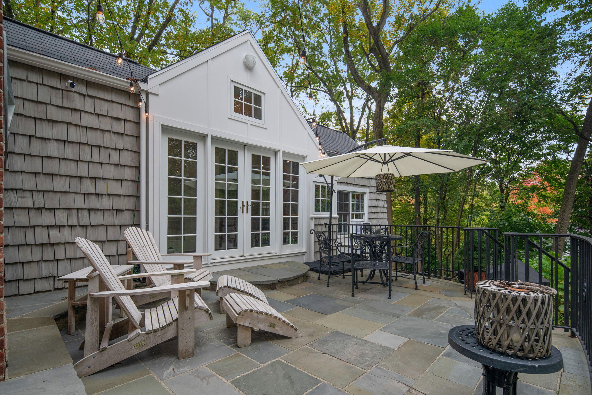 7 Little Brook Road Rowayton, CT 06853 - Photo 30 of 36 a backyard of a house with table and chairs