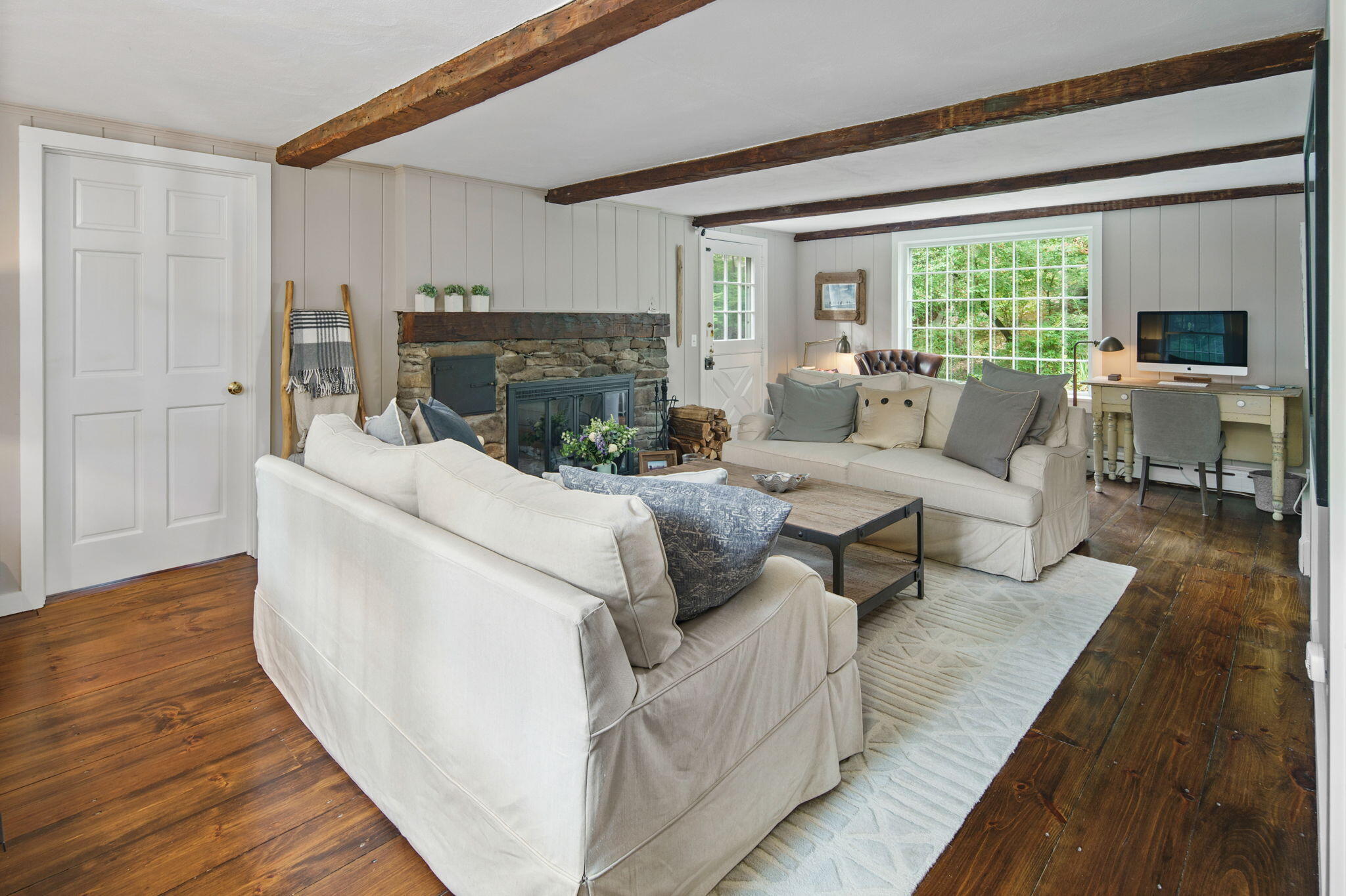7 Little Brook Road Rowayton, CT 06853 - Photo 5 of 36 a living room with furniture large window and a fireplace